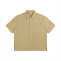Beige short-sleeve shirt with a pocket on a white background